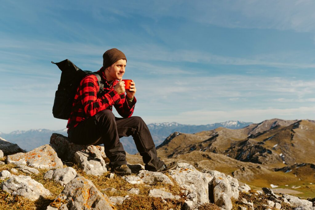 man hiking alone in the mountains